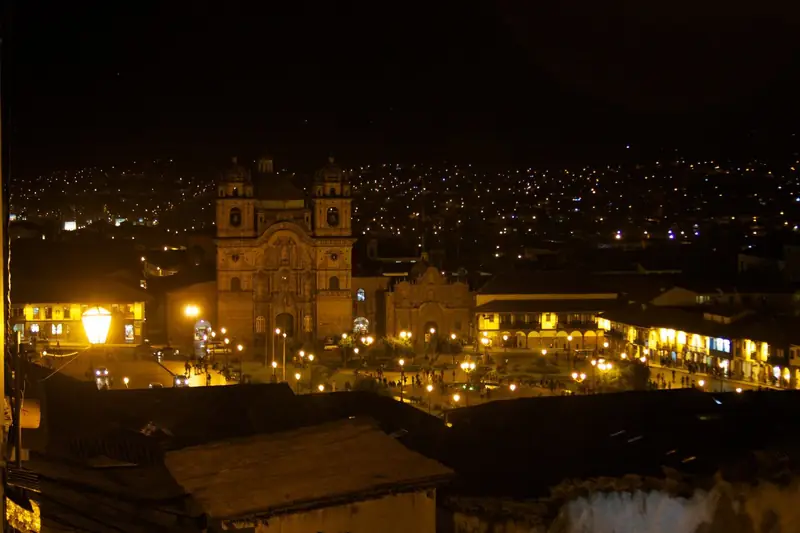 Cusco Plaza de Armas lit up at night, with the Compañía de Jesús church